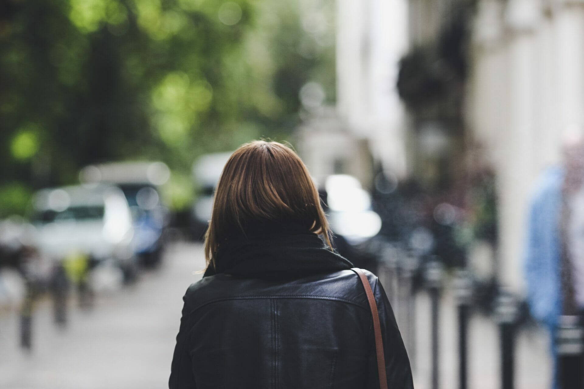 Woman walking abroad figuring out the hard truths of life abroad